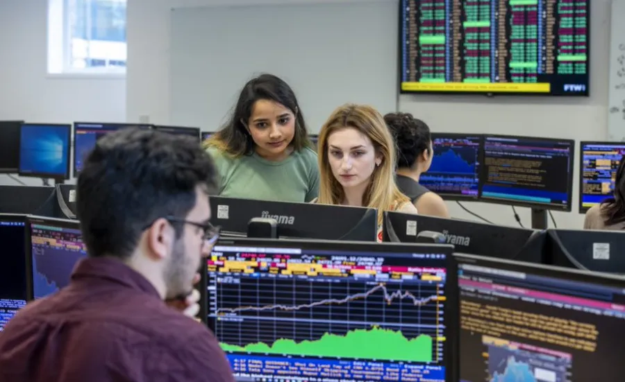 Students working at the Bloomberg terminals in the financial laboratory.