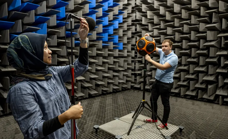 Two students using the large anechoic chamber