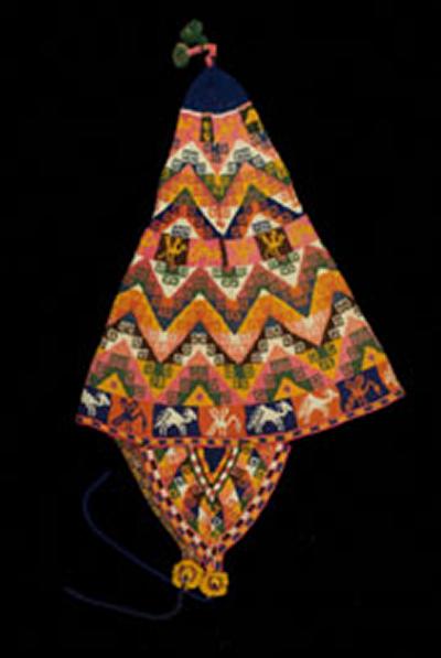 This cap originates from Bolivia in the mid to late 1900s, part of the Knitting Reference Library.