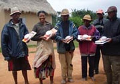 Families in Ambalamarine, Madagascar with solar powered lamps