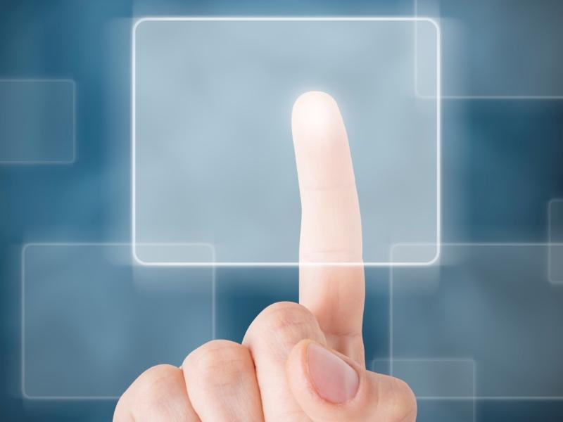 Finger pointing at screen