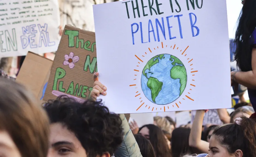 Peaceful protesters holding placards at a climate change rally