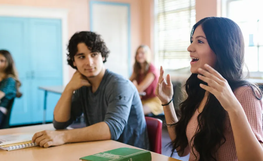 Pexels image of adult students engaging in classroom discussions