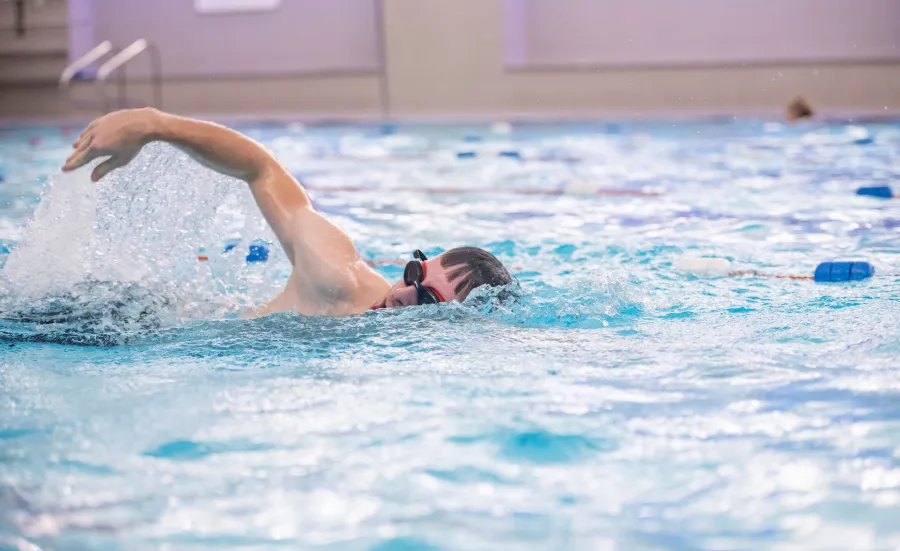swimmer doing breaststroke in pool