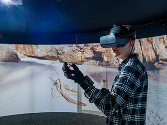 A student in a virtual reality headset