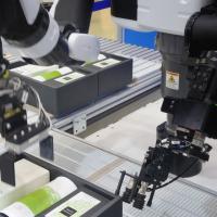 Robotic sensors packing products on a production line