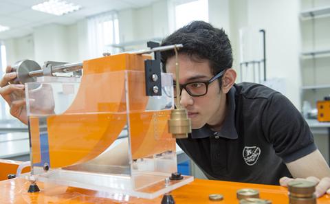Male student doing experiment