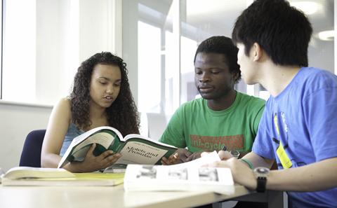 Three students in the library
