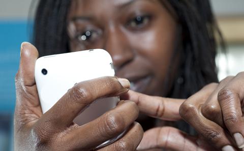 Graduate using a smartphone