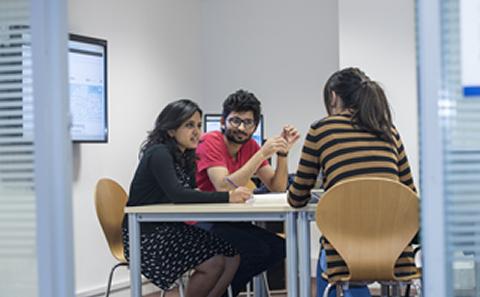 3 students working in a break out room