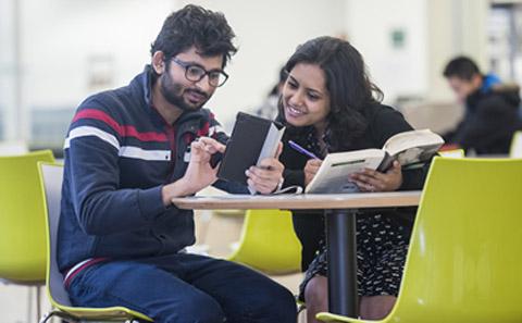 Students looking at a tablet