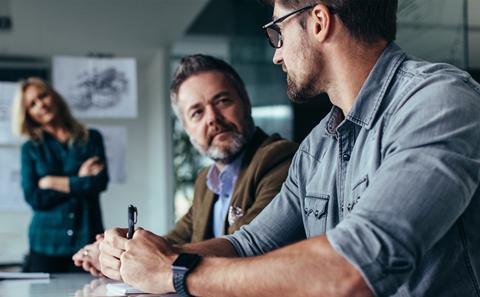 Academic sat at desk