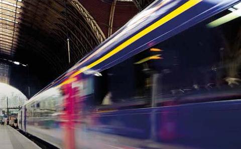 Train speeding through a railway station