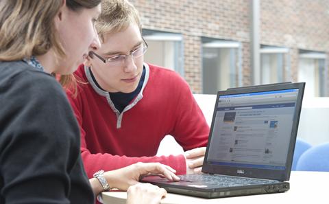 Students using a laptop