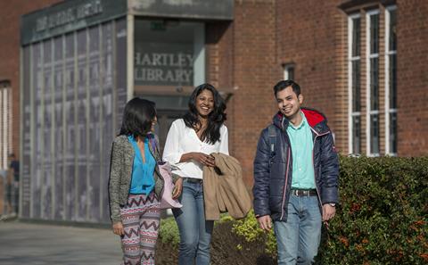students walking outside library