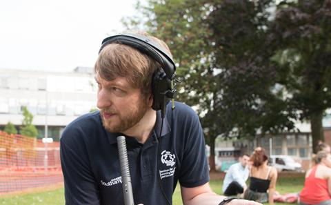 Man with podcast recording equipment