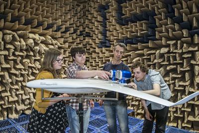 Jessica and her group with their model in the anechoic chamber