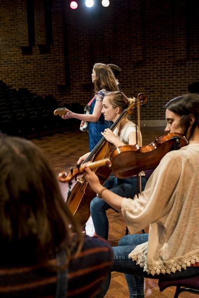 Students practicing with instruments
