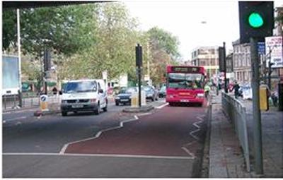 A bus travels on green light