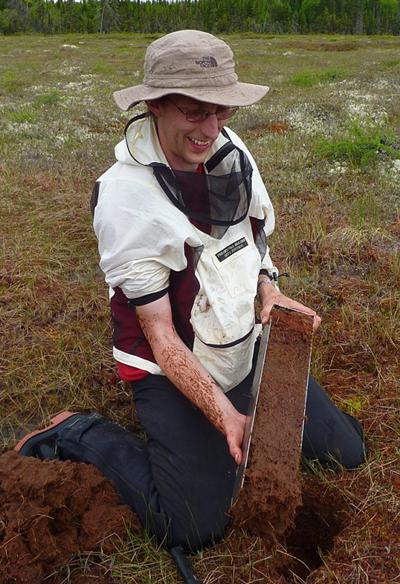 Sampling a plateau bog in northern Newfoundland