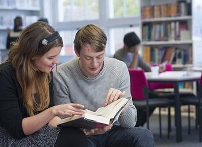 Students reading a book