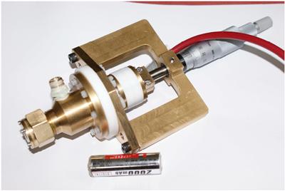 Electrostatic atomizer showing the micrometer used for adjusting electrode spacing