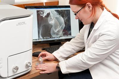 Student using microscope