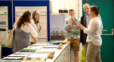 Professor Rachel Mills talking to students