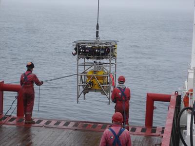 A robot carrying seismic recorder is launched towards the seabed