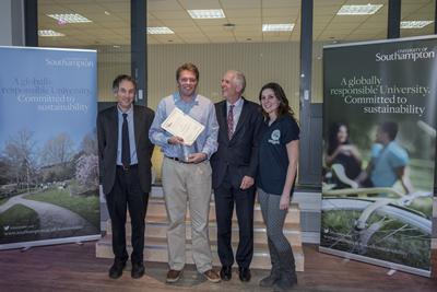 Alex Rogers receiving the award on behalf of the Joulo team