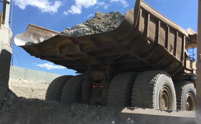 Rock ore prior to processing at a mine site