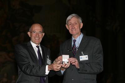 Ian is being presented with the 'medal and honorary membership of RSPSoc for life' from the President of the RSPSoc – Professor Paul Curran