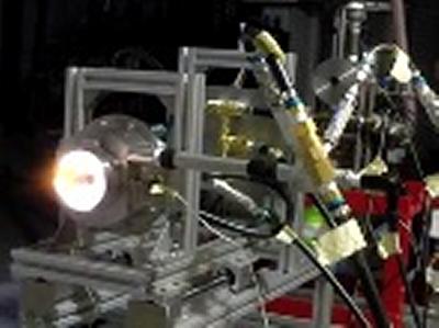 Fig. 3: Operation with 9.5g/s. Visible flame (left