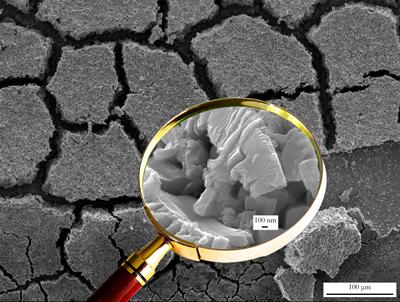 SEM image of tungsten oxide layer following corrosion of WC-Co sample taken at x200 and x30,000 magnification.