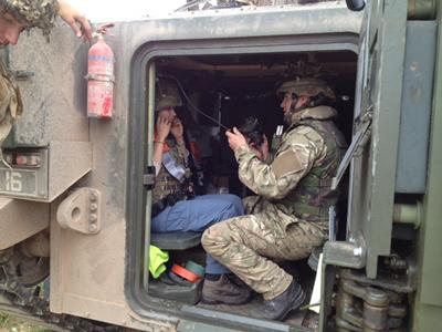 Researcher Hannah Semeraro gets to grips with the radio equipment inside a 'Warrior' armoured vehicle