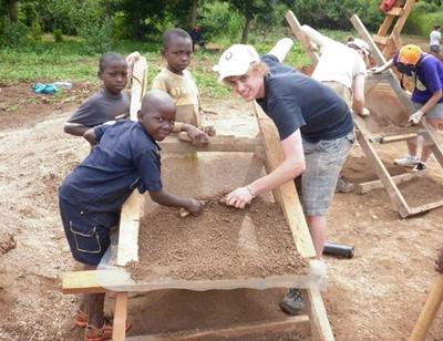 The students visit the village to help with the final stages of the build