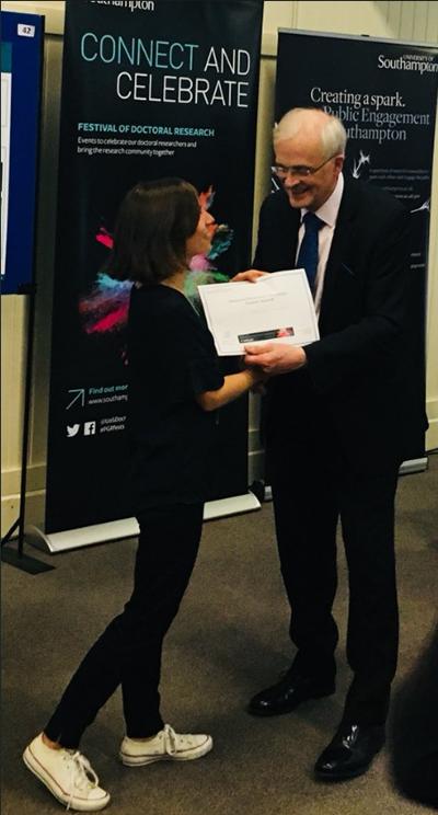 Catarina Moura presented with her award by Sir Christopher Snowden