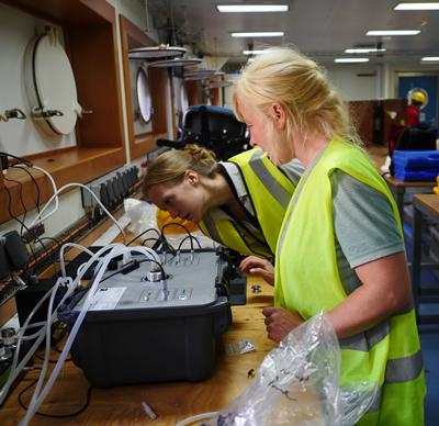 Photo of researchers installing instrument