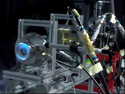 Fig. 4: Operation with 3.5g/s. Visible flame (left) 