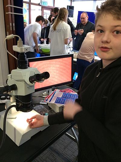 A happy budding microscopist at a BIU outreach event