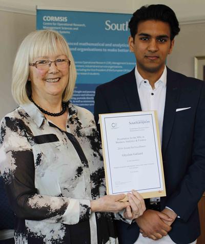 Photo of Ghyslain collecting award