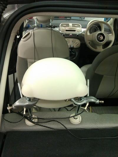 Rear headrests with microphones used for noise cancellation
