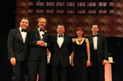 Chris receiving the award from host David Walliams