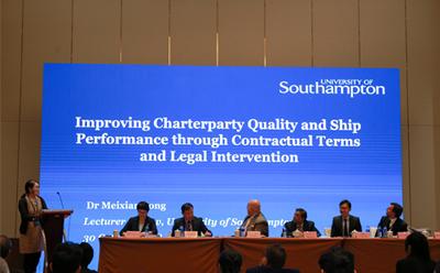 Dr Song on stage at conference