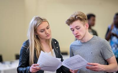 Students looking at documents