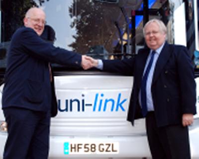 Simon Higman, University Registrar and Chief Operating Officer (left) and George Fair with one of the new uni-link buses