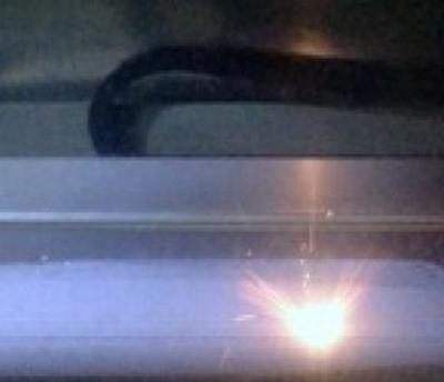 Laser scanning a powder bed