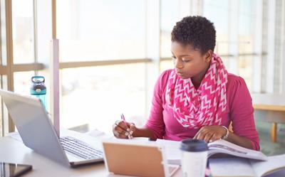 Student studying at home computer