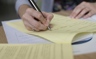 Person writing on paper
