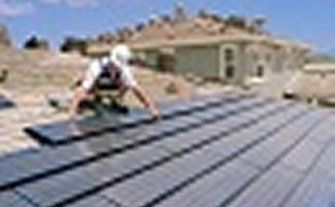 Technitian working on solar panels 